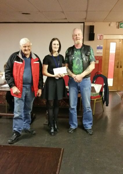 Ray and Trevor handing over a cheque for 520 to Abi Floyd from Acorns childrens hospice